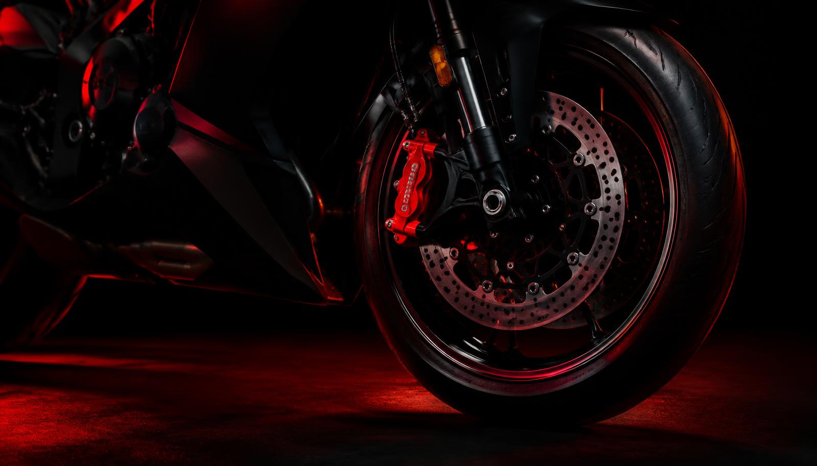 Motorcycle wheel with red brake caliper
